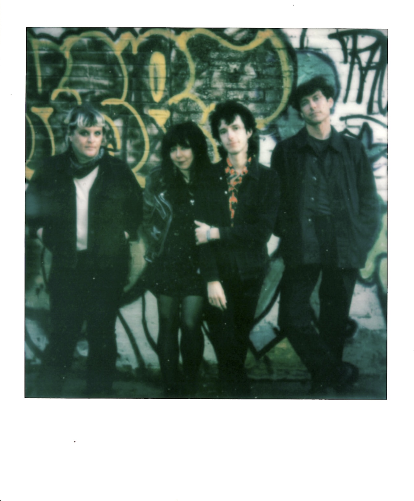 an image of the four members of the band cult objects.